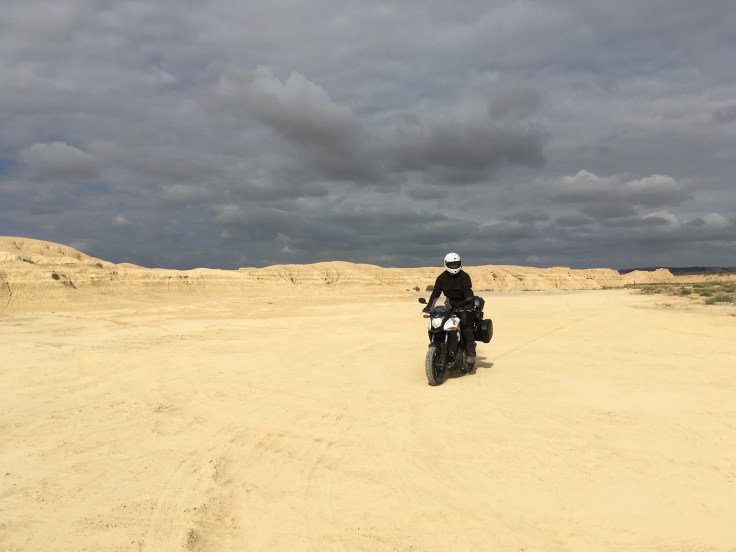 Motorcycle touring in the Bardenas Reales national park in Navarre, Spain.