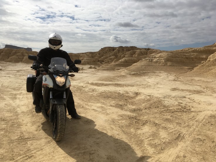Motorcycle touring in the Bardenas Reales national park in Navarre, Spain.