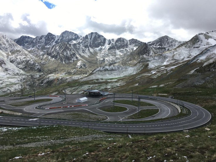 Motorcycle touring in the Pyrenees - France, Spain and Andorra. Snow-capped mountains and twisting roads.