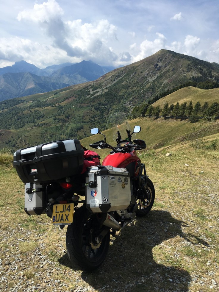 Motorcycle touring in Italy. Taking in breathtaking views.